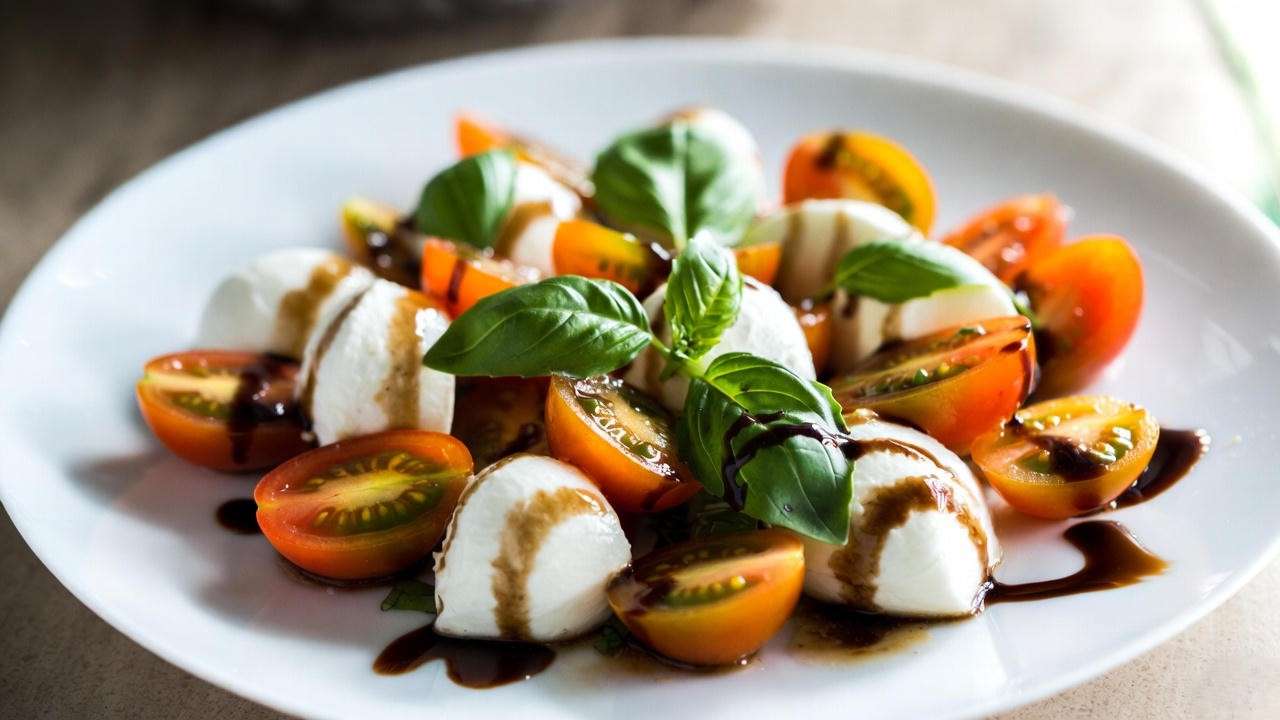 Fresh Caprese salad featuring Sun Gold cherry tomatoes