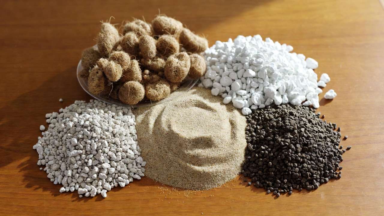 Close-up of key ingredients for quick-draining succulent soil mix including coco coir, perlite, pumice, coarse sand, and chicken grit
