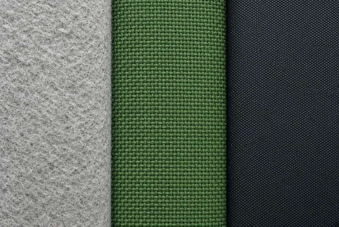 Close-up texture comparison of felt, canvas, and recycled plastic fabrics used for vertical grow bags for vegetables.